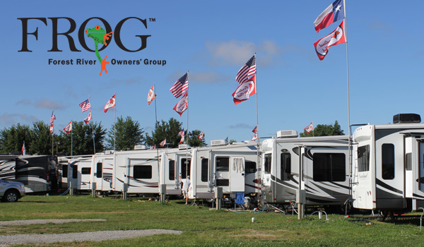 Row of RVs flying multi-national flags