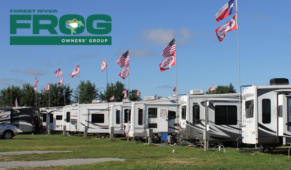 Row of RVs flying multi-national flags